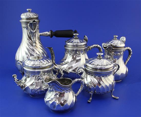 A late 19th/early 20th century French four piece silver tea and coffee set & two similar items, gross